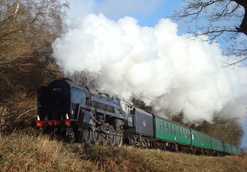Standard class '9F' 2-10-0, No. 92212, seen climbing from Alton to Medstead & Four Marks with a morning service from Alton to Alresford. (27th December 2009)