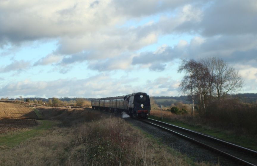 S.R. 'Battle of Britain' pacific No. 34067, 'Tangmere', seen here coasting down the gradient away from Ropley with an afternoon service from Alton to Alresford. (27th December 2009)