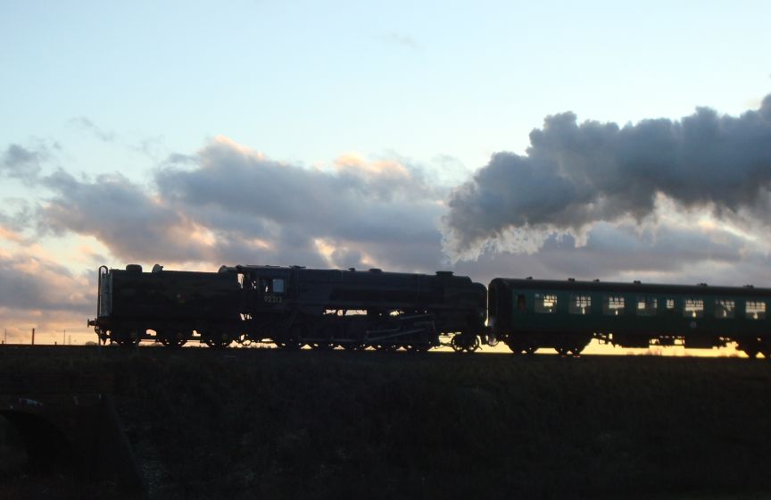 B.R. Standard class '9F' 2-10-0, No. 92212, seen here climbing towards Ropley with a late afternoon service from Alresford to Alton. (27th December 2009)