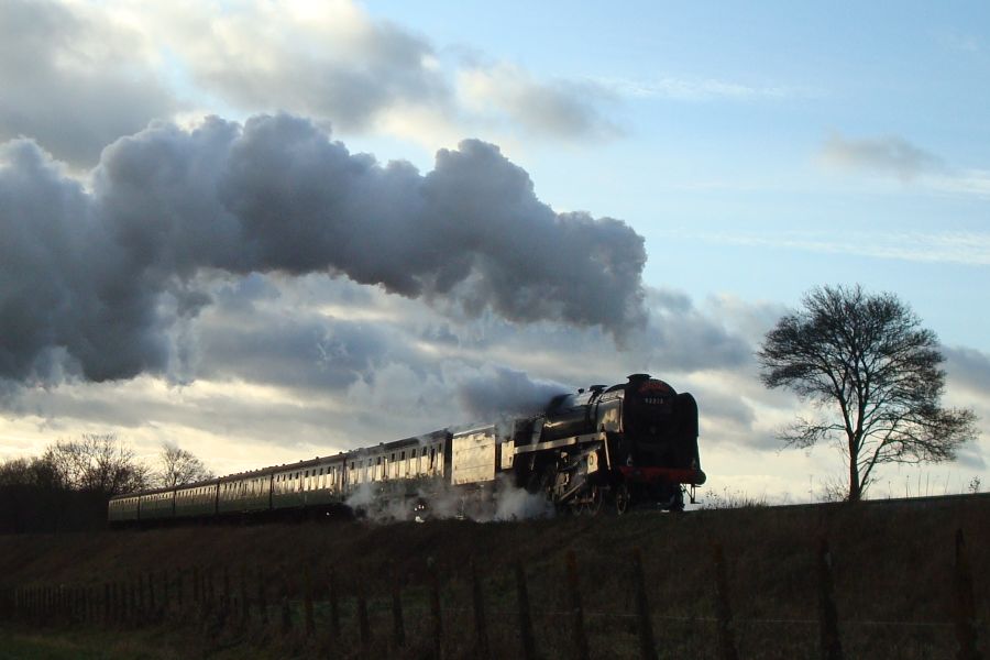 B.R. Standard class '9F' No. 92212 seen between Ropley and Medstead & Four Marks with a 'Santa Special' service from Alresford. (18th December 2011)