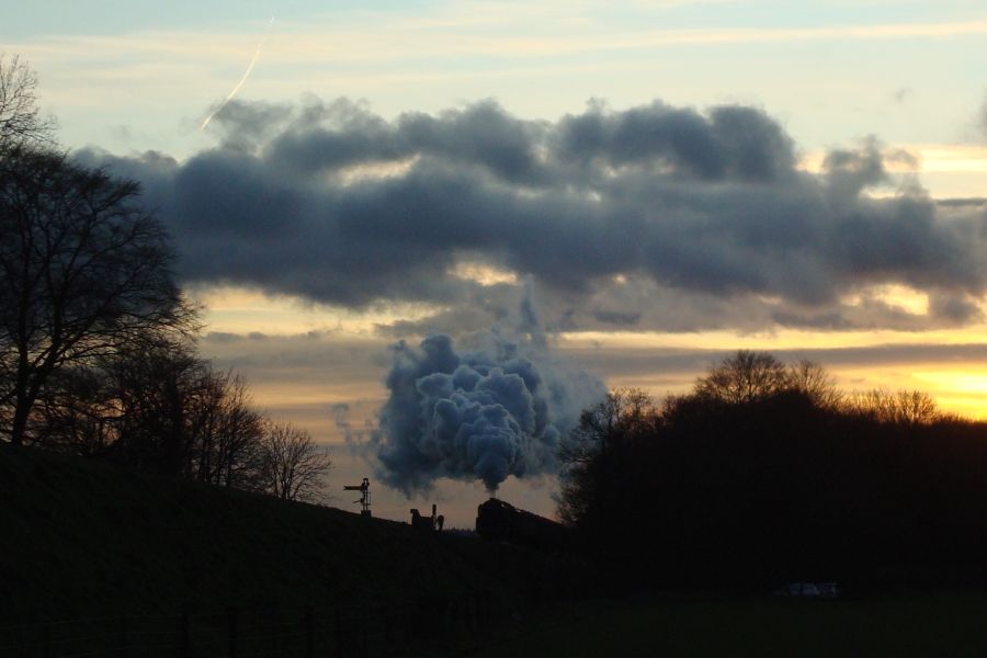 B.R. Standard class '9F' No. 92212 seen at sunset between Ropley and Medstead & Four Marks with a 'Santa Special' service from Alresford. (18th December 2011)